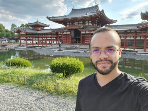 Cristian Dávila posing in front of the Byodo-in Temple in Uji Kyoto Japan