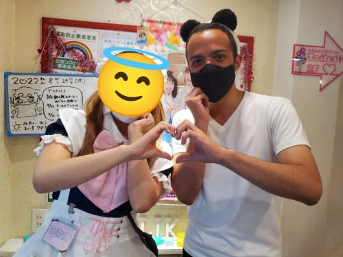 Cristian Dávila doing a cute pose with a Maid Girl at a Maid Cafe in Tokyo Japan 2022